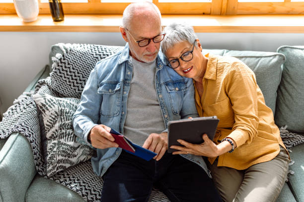 istock Senior couple searching best solution for vacation 1480152471