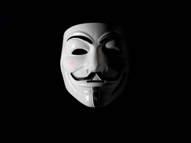 Guy Fawkes mask. Guy Fawkes mask half hidden in the shadows. vendetta stock pictures, royalty-free photos & images