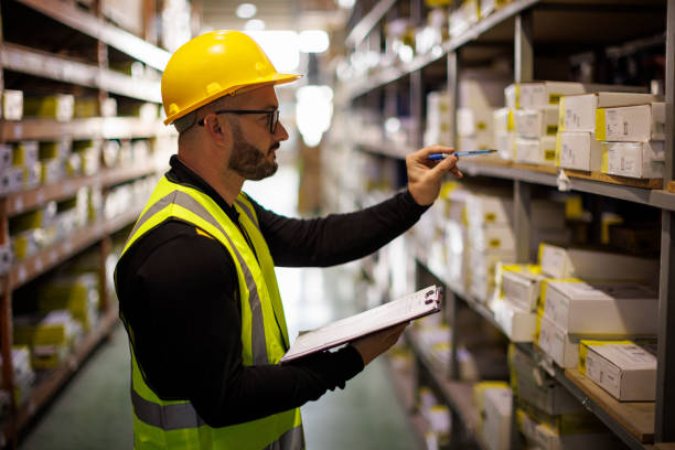 istock Male warehouse employee doing a checklist 1480156006