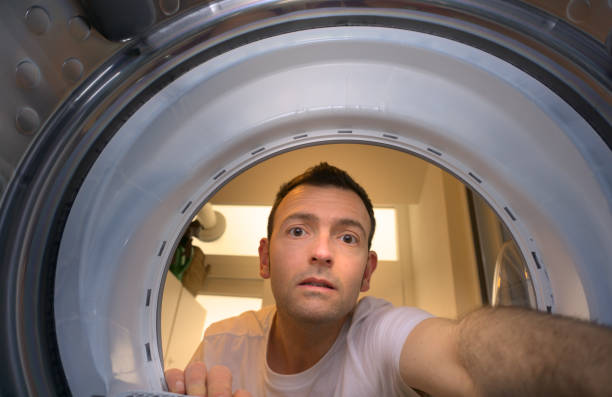 istock Young male mechanic repairing washing machine 1480162005