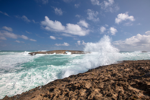 Large storm waves crashing into Laie Point rocky coastline at Kaawa on the North Shore of Oahu Hawaii United States