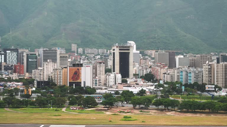 Aerial panoramic view of Caracas downtown. High buildings with the mountains on the background. The most dangerous cities in the world