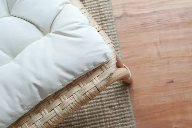 Photo of Close up weave pattern with white mattress chair texture and background. Outdoor wicker bed with white mattress