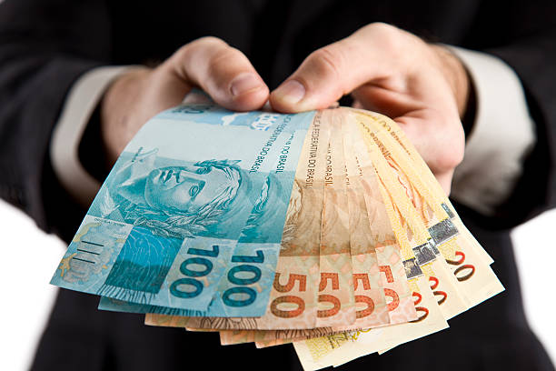 business-mann mit geld. - currency giving wealth human hand stock-fotos und bilder