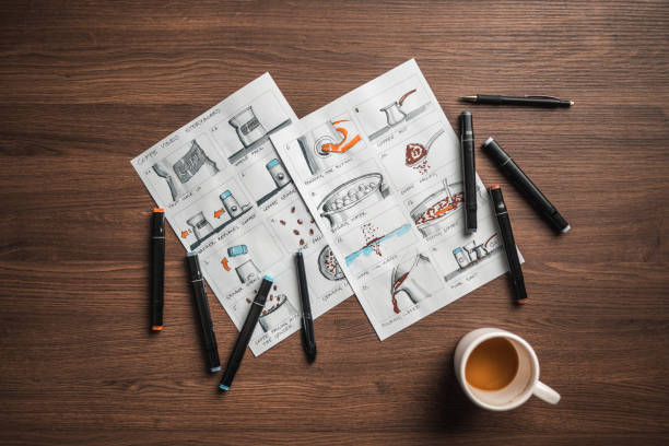 istock Storyboard Editors Table; Coffee, Colored Pencils And A Smartphone 1480182480