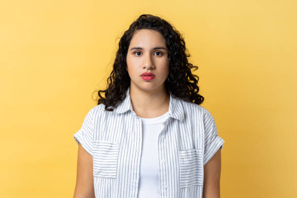 istock Woman looking at camera with calm attentive focused expression, having serious look. 1480182833