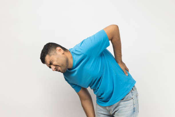 istock Sick unshaven man touching his back, having problems with kidney, has trauma, needs treatment. 1480184485