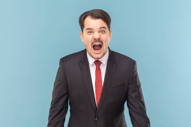 istock Angry furious man with mustache standing standing and screaming loud with hate and anger. 1480184624