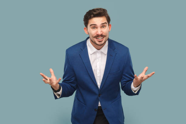 istock Aggressive attractive man with mustache standing with clenched hands, yelling with hate and anger. 1480184650