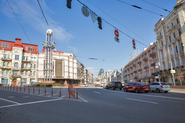 Lev Tolstoy square in Kyiv downtown, Ukraine. Kyiv, Ukraine - March 18, 2023: People walk along Lev Tolstoy square. It is a triangular intersection in Kyiv downtown. leo tolstoy stock pictures, royalty-free photos & images