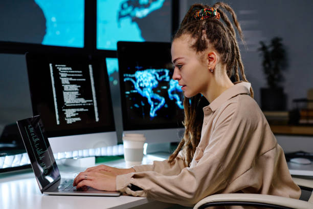 istock Young serious female IT manager typing on laptop keyboard in office 1480186483