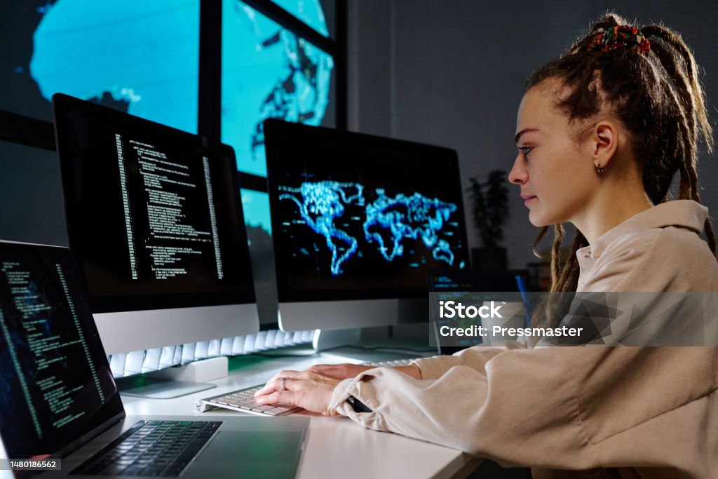 Side View Of Young Programmer Developing New Software Or Decoding Data ...