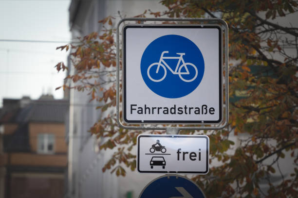 istock german bicycle boulevard roadsign in Cologne with the mentions in German language fahrradstrasse and frei, meaning bicycle street and free in german. It's a low speed street where bicycles and bikes have priority. 1480186568