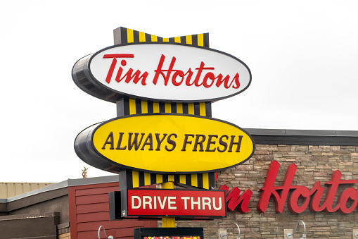 Calgary, Alberta, Canada. Apr 04, 2023. A Tim Hortons, always fresh and drive thru sign.