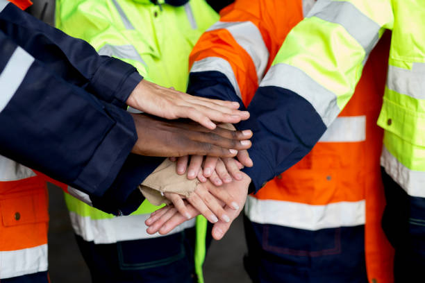istock Closeup group of engineer team harmonious with hands stack for goal and success at factory industry, worker teamwork and community for harmony, technician join hands and support, industrial concept. 1480189411