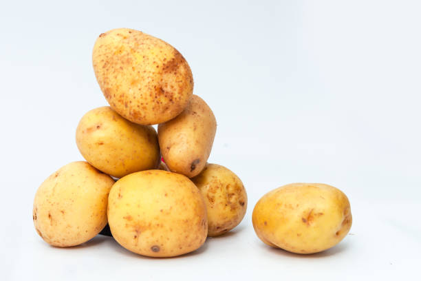 istock Group of fresh potatoes isolated on white background 1480216987
