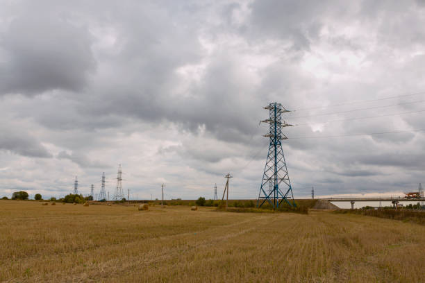 istock Power lines against a gray stormy sky 1480220909