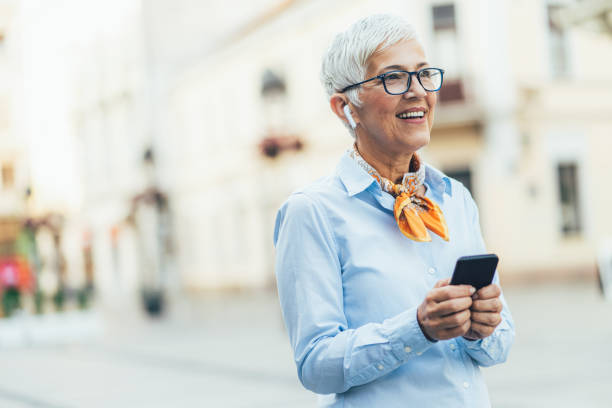 istock Mature woman with smartphone 1480223563