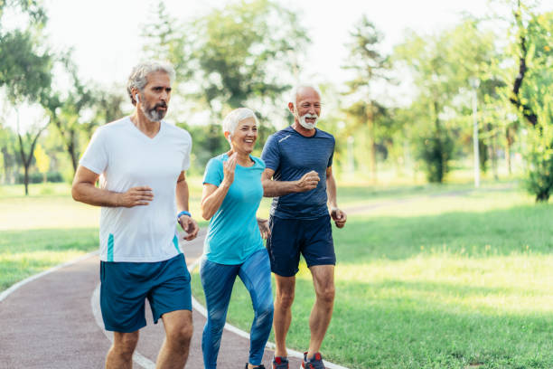 istock Three senior friends jogging together 1480223565