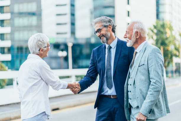 istock Senior business people handshake 1480223566