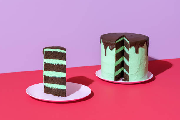 istock Chocolate layer cake with mint flavor buttercream, minimalist on a red table 1480225801
