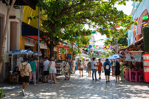 March 6th, 2023. Playa del Carmen, Quintana Roo, Mexico. 5th Ave. This avenue is the most popular in the city, it is parallel to the beach and has many shops where thousands of people visit it every day. There are several local and chain stores for clothing, food, clubs and bars.