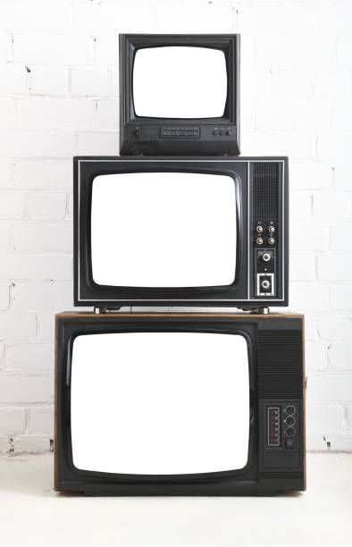 istock Three old televisions with white screens against a background of white bricks. 1480228004