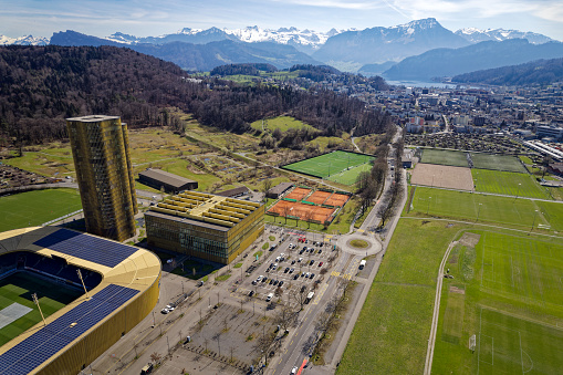 Aerial view of City of Luzern with football stadium of FC Luzern on a blue cloudy spring day. Photo taken March 22nd, 2023, Lucerne, Switzerland.