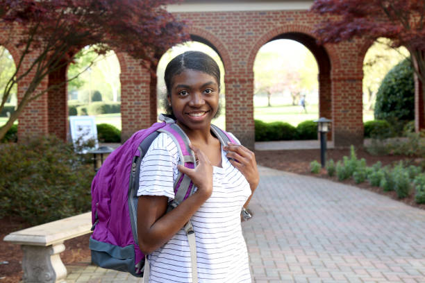istock African American teenager posing with backpack. 1480229677