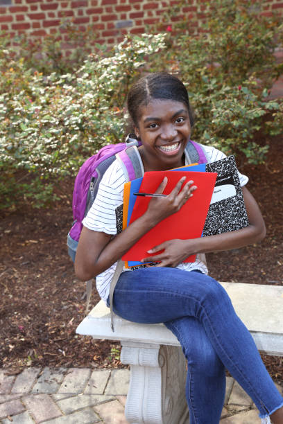 istock African American teenager posing with backpack. 1480230366