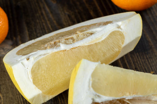 istock ripe yellow pomelo cut into pieces close-up 1480235369