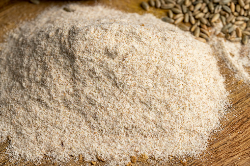 Wheat flour with bran for cooking bread, unrefined organic flour with bran from wheat grain