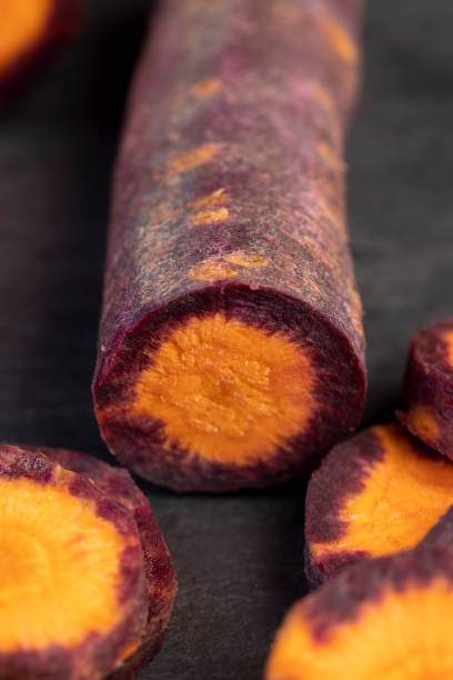 Pieces of sliced peeled carrots are red-orange in color