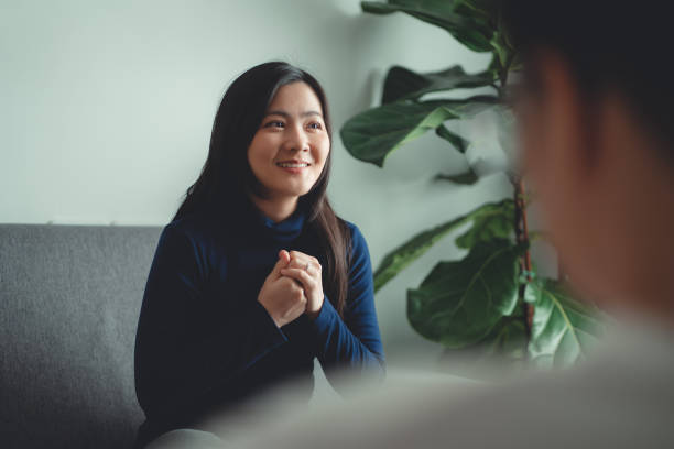 istock Asian woman talking with psychologist about problems after married sitting on sofa in counseling office. 1480243273