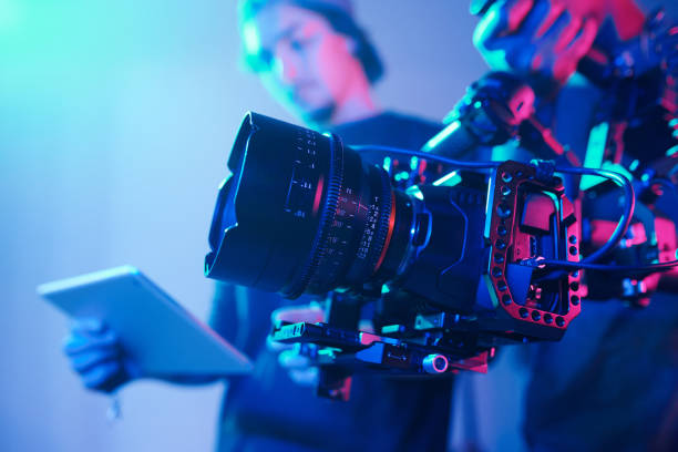 Camera crew with professional camera in studio stock photo