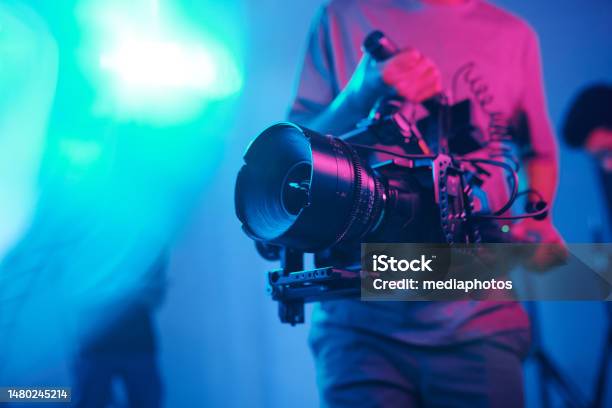 Cameraman Shooting With Professional Camera Stock Photo - Download Image Now - Movie Camera, Movie, Camera - Photographic Equipment