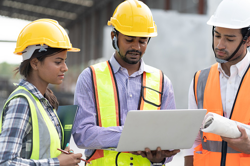Engineer Fu India Engineer Man Holding Laptop Computer With Team Engineer At ...