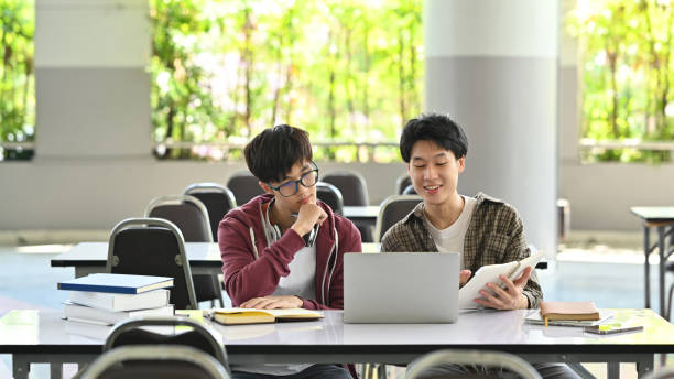 istock Asian students are using laptop, working together on academic project. Education, Learning and technology concept. 1480250248