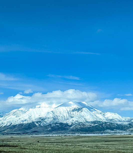 istock Snowy mountain in the clouds 1480250823