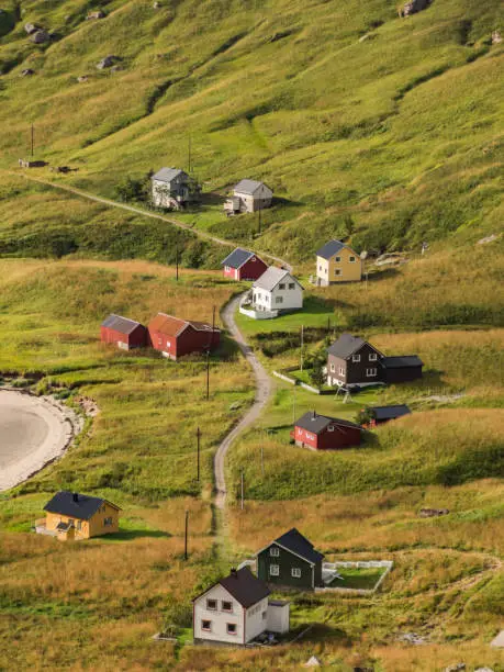 View of the village from the trail to  Helvetestinden  from Bunes beach in Norway