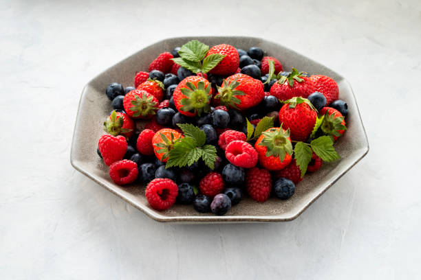 istock Strawberries, blueberries, raspberries, on the table. Copy space. 1480260808