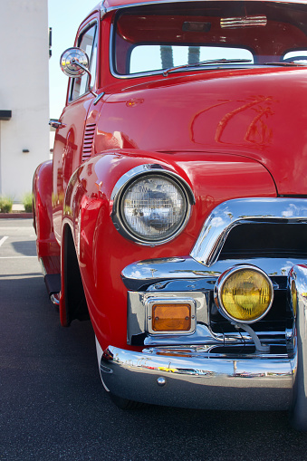 Partial profile of a vintage red pickup truck