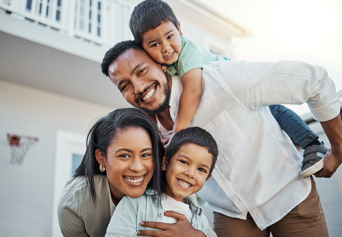 istock Portrait, happy family and piggyback outdoor at new home, real estate loan and building mortgage together. Parents, kids and smile outdoor for property investment, moving house and future security 1480267239