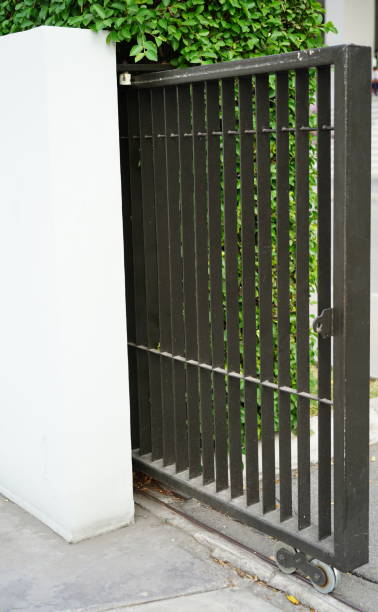 istock Side view of sliding metal fence gate 1480267376