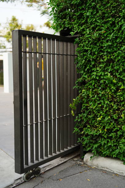istock Side view of sliding metal fence gate 1480267412