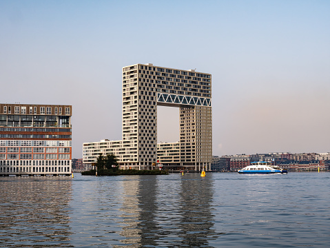 Modern apartment building Pontsteiger in Houthaven on south bank of river IJ, Amsterdam, Netherlands
