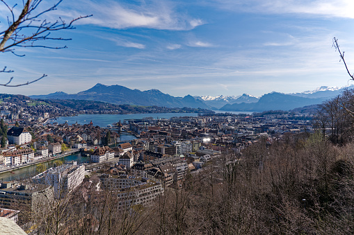 Spectacular panoramic view over lake Lucerne with the city on the right and Mountain Pilatus in the middle and snow covered Eiger, Mönch and Jungfrau.