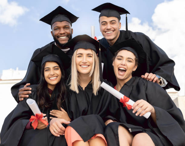 istock Graduation, student group and happy portrait for success, diversity and sky background. International graduates, friends and celebration of study goals, award and smile for college education event 1480277392