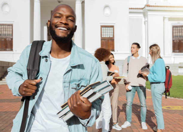 istock Portrait, black man and students on campus, outdoor and conversation for knowledge, growth and learning. African American male, student and academics on university, development and higher education 1480279935