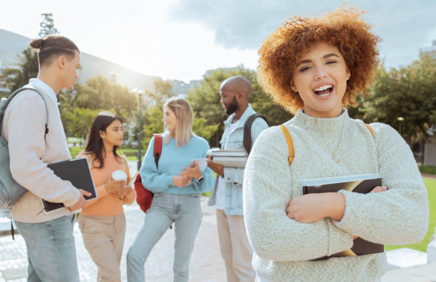 istock University, campus and black woman portrait with students group, learning community and education planning. Happy friends, gen z person or diversity youth with scholarship, teamwork and study mission 1480279937